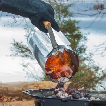 Lodge Charcoal Chimney Starter with burning charcoal