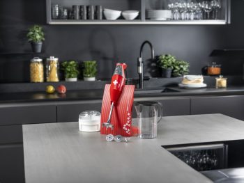 Bamix SwissLine Immersion Blender 200W Red with Swiss Flag - 70th Anniversary Model on bench with accessories