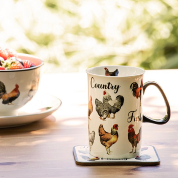 Ashdene Heartland Can Mug 350m on a heartland coaster , a top a table in a summer garden.