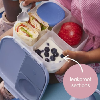 Lifestyle image of B.Box Mini Lunch Box Midnight open with food in compartments, showing leak proof compartment.