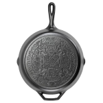 Lodge Butterfly Sugar Skull Skillet standing upright showing pattern on the base.