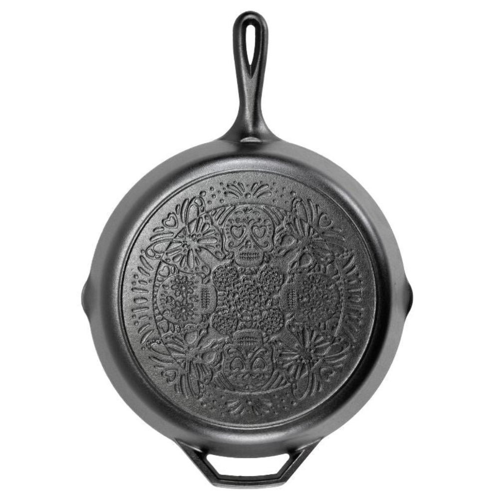 Lodge Butterfly Sugar Skull Skillet standing upright showing pattern on the base.
