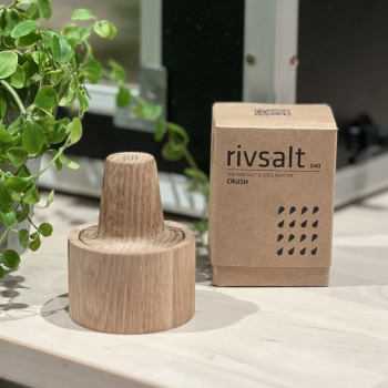 Rivaslt Crush Salt & Spice Mortar on a table in the sun with boxing.