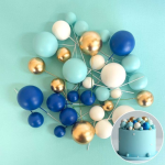 Foam Ball Decoration Blue White Gold on a teal background.