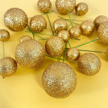 Gold Foam Ball Decorations on a yellow background.