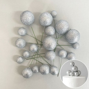 20 Silver Ball Decorations in a pile on a grey background.