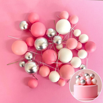 Foam Ball Decoration Pink White Silver on a pink background.