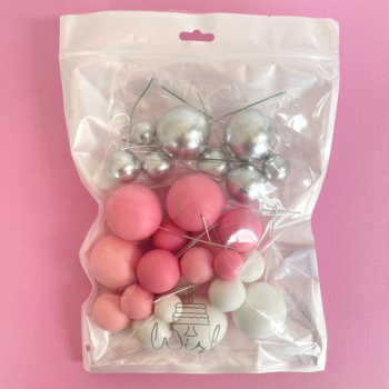 Foam Ball Decoration Pink White Silver in packaging on a pink background.