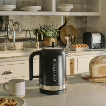 Lifestyle image of Dualit Classic Kettle Matte Black on a kitchen bench.