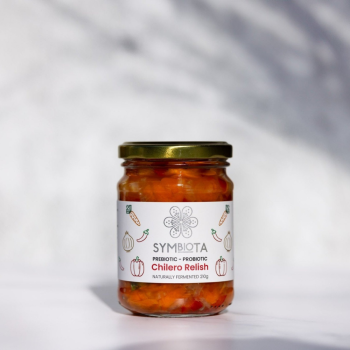 Symbiota Chilero Relish 210g on a grey background.