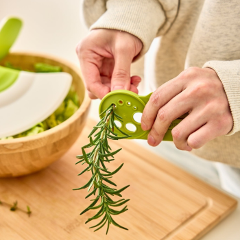 Prepara Herbs n Greens in use on a board.
